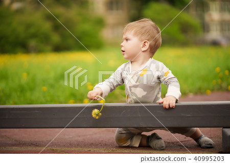 Portrait of adorable baby playing at playground Portrait of adorable baby playing at playground 40995203