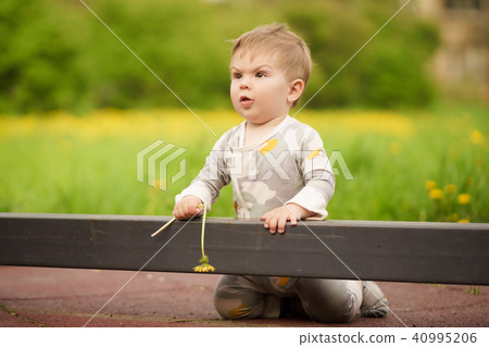 Portrait of adorable baby playing at playground 40995206