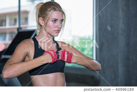 A beautiful woman training with resistance band A beautiful woman training with resistance band 40996189