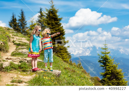 Children hiking in Alps mountains. Kids outdoor. Children hiking in Alps mountains. Kids outdoor. 40998227
