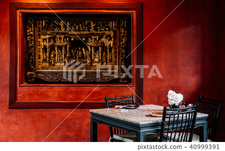 Red Chinese interior room with table, wooden chair Red Chinese interior room with table, wooden chair 40999391