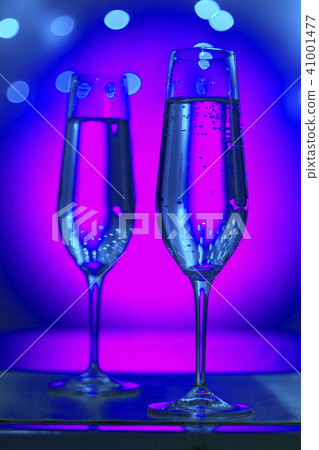 Champagne glasses in disco party bar Champagne glasses in disco party bar 41001477