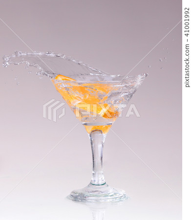 cocktail in a martini glass on a white  41001992