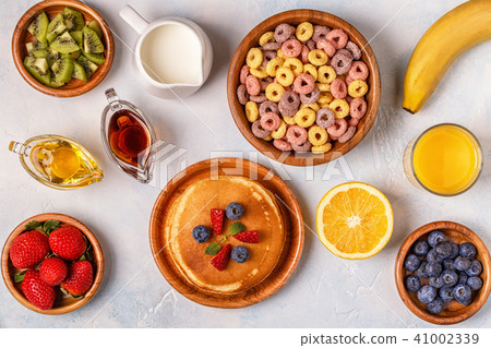 Breakfast with colorful cereal rings, pancakes 41002339