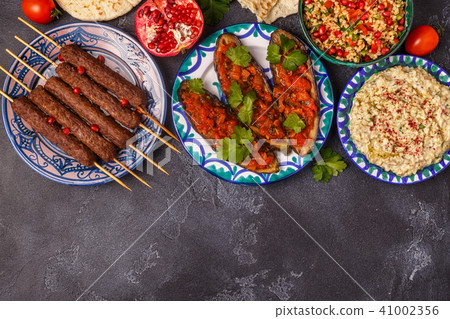 Classic kebabs, tabbouleh salad, baba ganush  41002356