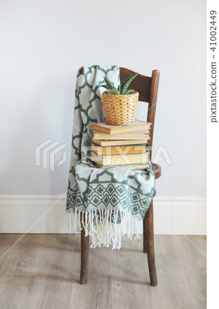 Old chair with books Old chair with books 41002449