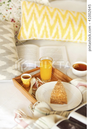 Cozy breakfast in bed with tea 41002645