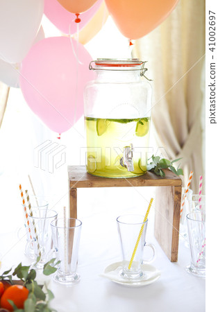 Citrus homemade lemonade in a beverage dispencer 41002697