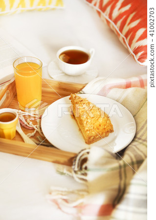Cozy breakfast in bed with tea 41002703