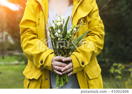 Young woman with lily of the valley 41002806