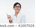 Business woman posing on whiteboard on white  41007028