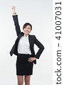 Business woman posing on whiteboard on white  41007031