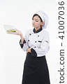 portrait of asia clef woman with food on white 41007036