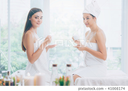 Two women drinking tea in luxury day spa. 41008174