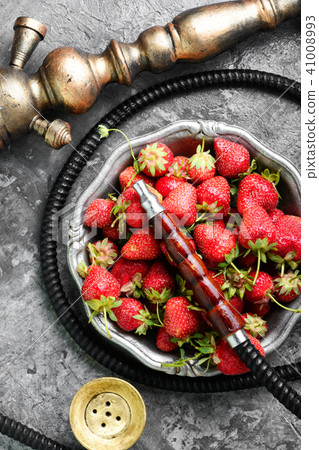 Stylish oriental shisha with strawberry Stylish oriental shisha with strawberry 41008993