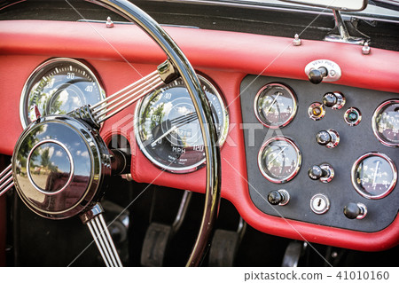 Steering wheel and dashboard in vintage car Steering wheel and dashboard in vintage car 41010160