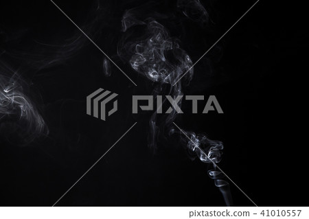 Smoky isolated swirl of smoldering aroma stick 41010557