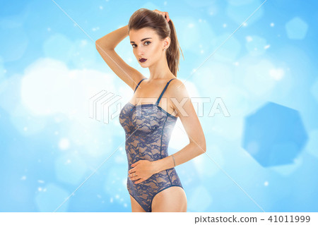 Slim cute girl posing in front of the camera  41011999