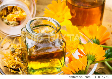 Medicine bottle and herbs calendula Medicine bottle and herbs calendula 41014760