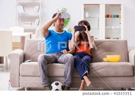 Man watching football on virtual reality vr glasses 41015351