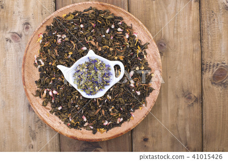 Different tea with flowers and herbs on a wooden background. Aromatherapy and health. Copy space. 41015426