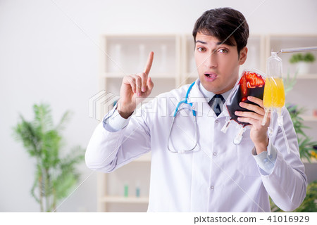 Doctor with bag of blood plasma in hospital 41016929
