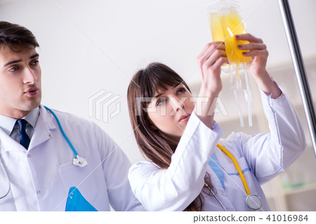 Two doctors discussing plasma and blood transfusion 41016984