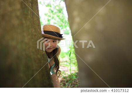Girls playing in the forest 41017312