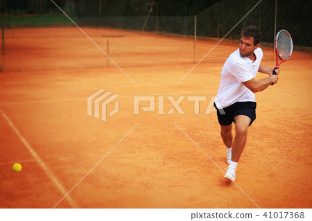 Tennis, player strong punches the ball  41017368