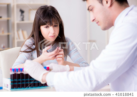 Patient during blood test sampling procedure taken for analysis 41018841
