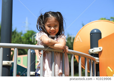 Girl in playground Girl in playground 41019906