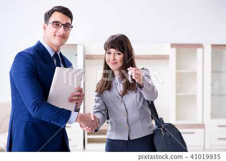 Real estate agent showing new apartment to owner Real estate agent showing new apartment to owner 41019935