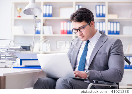 Disabled businessman working in the office Disabled businessman working in the office 41021288