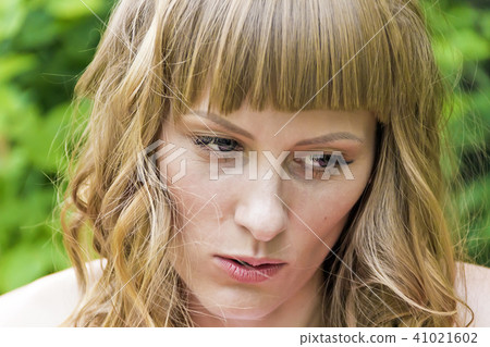 Portrait of young woman with blond hair 41021602