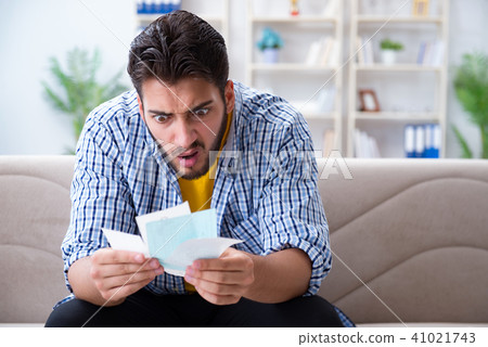 Man angry at bills he needs to pay Man angry at bills he needs to pay 41021743