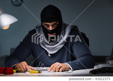 Terrorist bomber preparing dynamite bomb 41022375