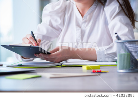Woman hands working on computer at desk Woman hands working on computer at desk 41022895