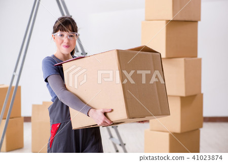 Woman contractor moving boxes in relocation concept Woman contractor moving boxes in relocation concept 41023874