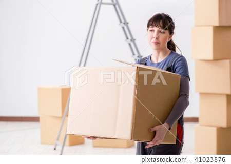 Woman contractor moving boxes in relocation concept 41023876