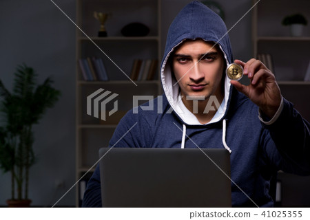 Young man in bitcoin mining concept Young man in bitcoin mining concept 41025355