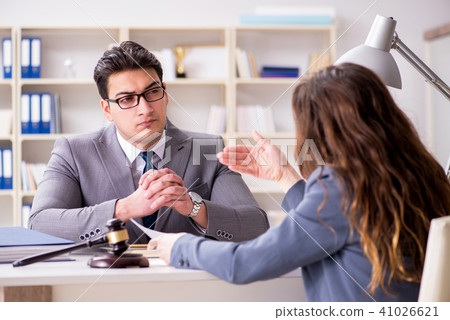 Lawyer discussing legal case with client Lawyer discussing legal case with client 41026621