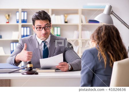 Lawyer discussing legal case with client Lawyer discussing legal case with client 41026636