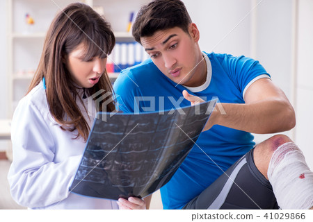 Sports player visiting doctor after injury Sports player visiting doctor after injury 41029866