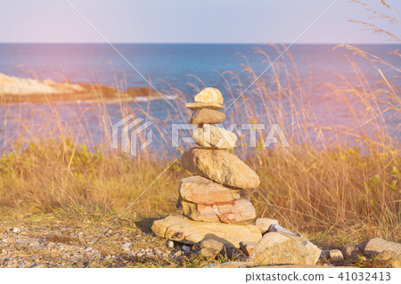Stacked stones over ocean skyline 41032413