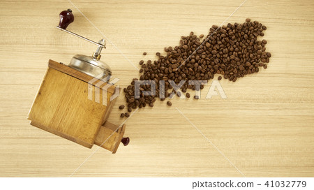 Coffee grinder with coffee beans on wooden  41032779