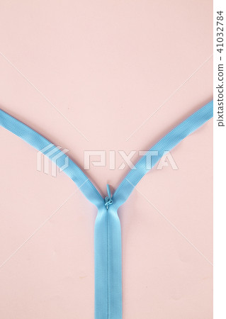 Blue zipper with pink background Blue zipper with pink background 41032784