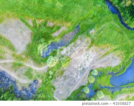Beautiful green meadow with ponds and trees 41038827