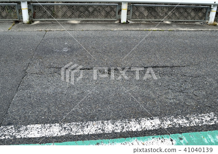 Damaged asphalt pavement 41040139