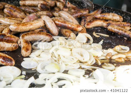Wild Boar Sausage and Onions on grill 41041122