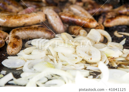 Wild Boar Sausage and Onions on grill 41041125